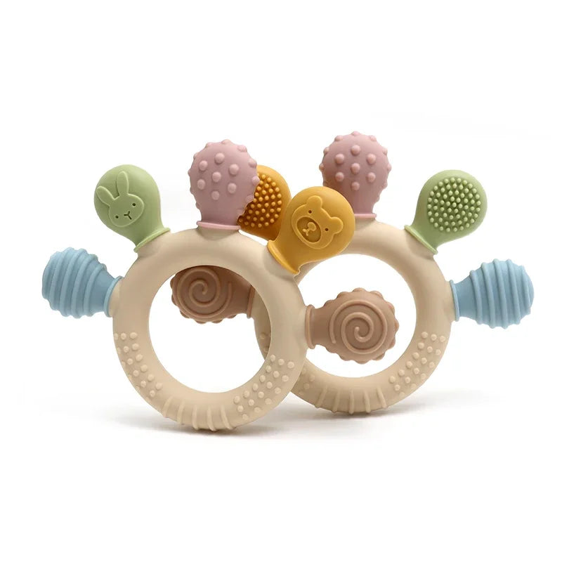 Colorful baby teething ring with multiple textures on a white background