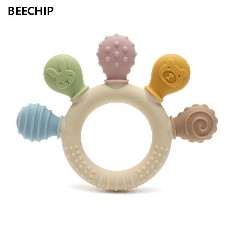Colorful silicone teething ring with various textures on a white background, branded 'BEECHIP'.