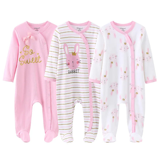 Three baby onesies with different designs on a white background