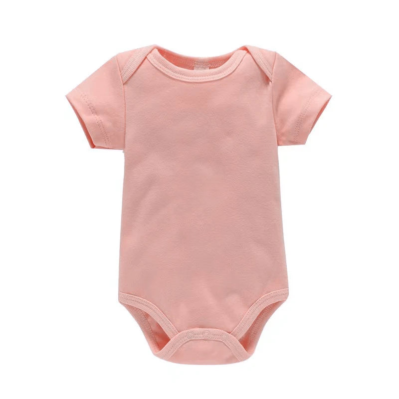 Pink baby onesie on a white background
