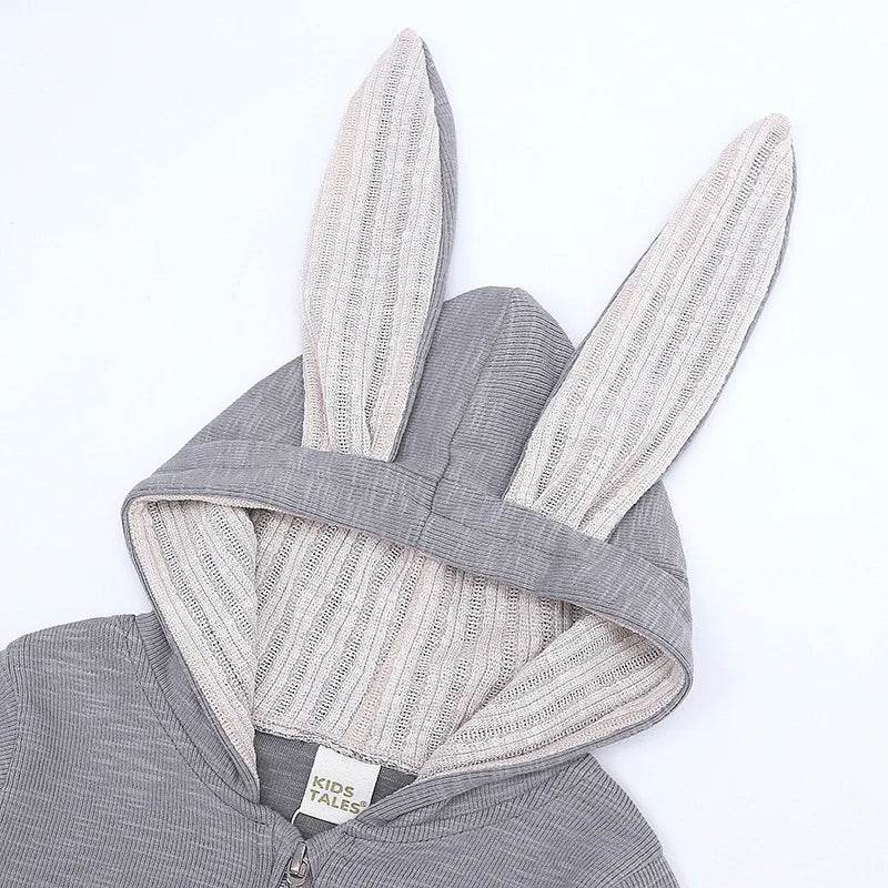 Gray baby onesie with bunny ears on a white background