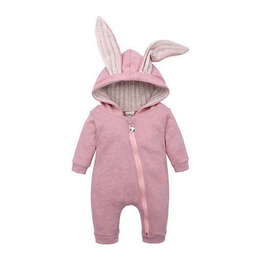 Pink baby onesie with bunny ears on a white background
