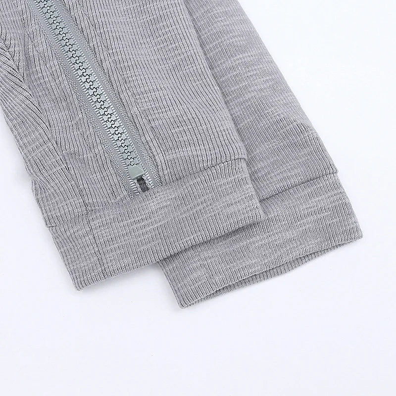 Gray ribbed knit fabric with a zipper on a white background