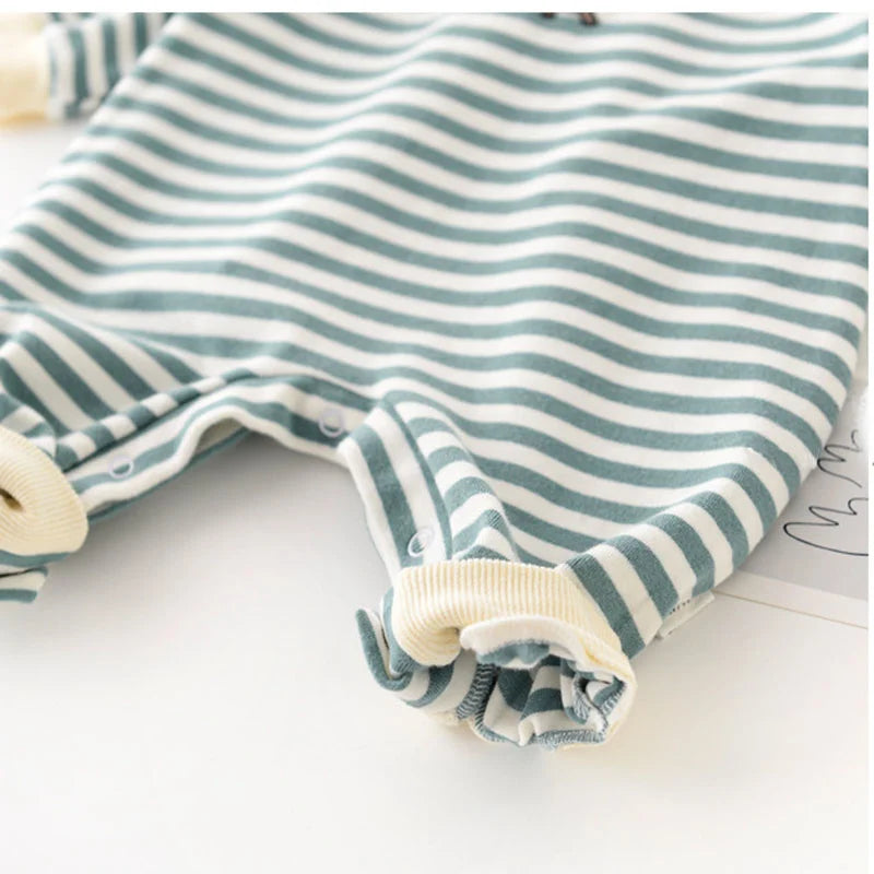 Striped baby romper with buttons on a white background