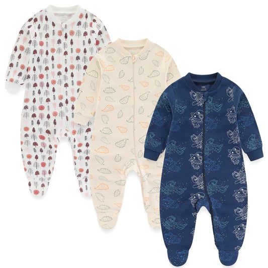 Three baby onesies with different patterns on a white background