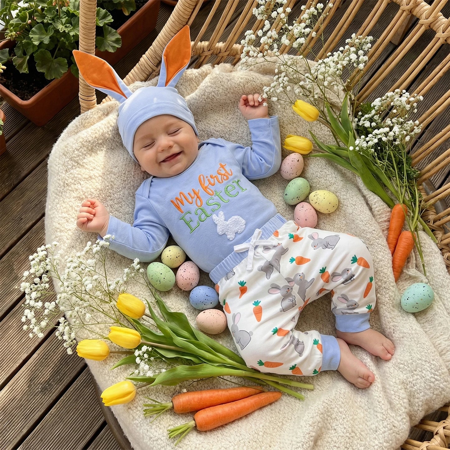 Baby wearing Easter bunny outfit with rabbit ear hat
