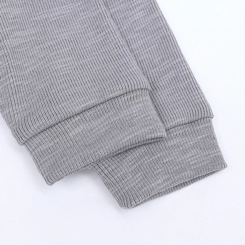 Gray knit pants on a white background
