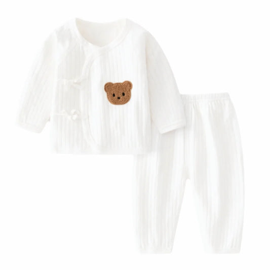 White long-sleeve shirt with a brown bear design on a white background